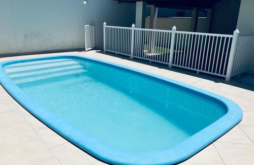 Barra de Ibiraquera Apartment | Townhouse composta por 4 triplex duas suítes a duas quadras do mar