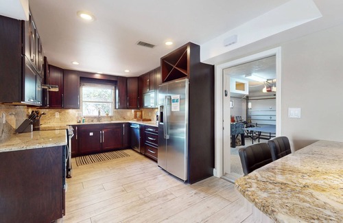 Cocoa Isles House | Tropical home with pool, lovely patio & game room - walk to beach