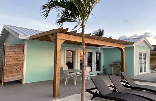 Alice Town Cottage | Unique, authentic, exquisite waterfront cottage with a dock.