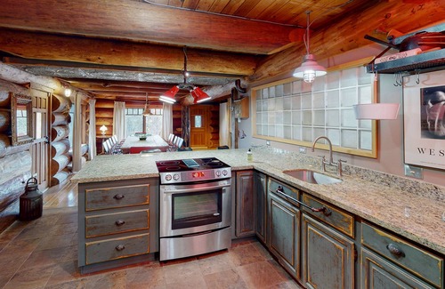 Carnation House | Unique mountain view log home with a wood stove, balcony, patio, & board games