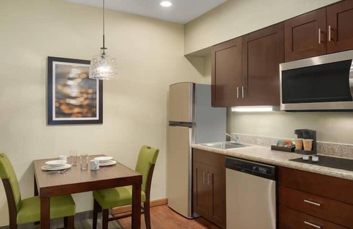 Feather Sound Hotel | Unwind and Indulge In Our Oasis! Outdoor Pool, Free Breakfast, Full Kitchen!