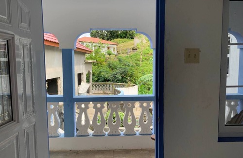 Fairy Hill House | Upstairs Room with Terrace at RobinHood guesthouse