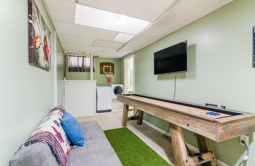 Manhattan House | Walk To Aggieville from Brick Cottage with Man Cave, Shuffle Board, Back Yard