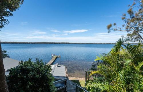 Sunshine House | Waterfront Vista Escape with Games Room Jetty Access & Expansive Views