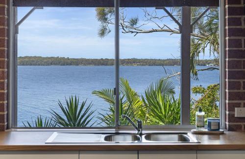 Sunshine House | Waterfront Vista Escape with Games Room Jetty Access & Expansive Views