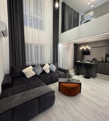 2 Level 1 Bedroom Lux Apartment with Balcony 75 Inch TV and Sofa Bed near Promenada Mall with High Ceilings Kitchen Washer and Work Space