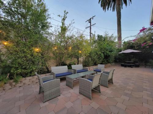 3 bedroom guest suite first floor unit with nice patio area right next to the MrC Hotel 10 minutes from Rodeo Drive Washer Dryer WIFI and more