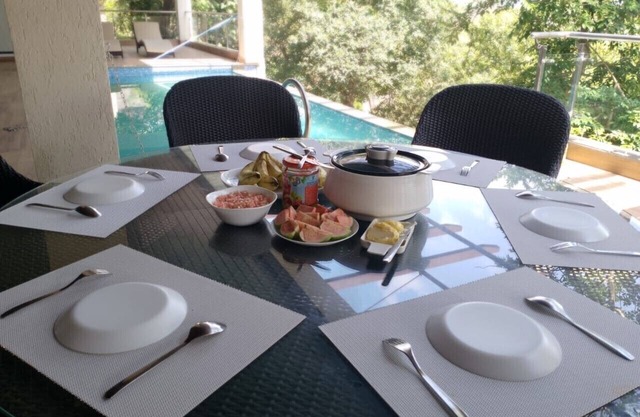 A 4 BHK VILLA WITH A PRIVATE INFINITY POOL SURROUDED BY SERENE HILLS