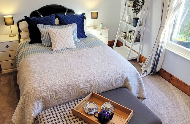 A charming 4-bedroom home! Just steps away from cozy cafes and local shops.