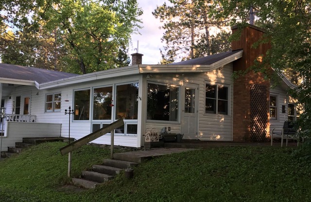 A charming home on a beautiful peninsula on a crystal clear lake.