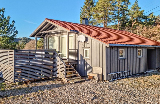 A house with a beautiful view and fishing and swimming right by the house.