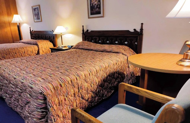 Affordable Comfort Near Attractions | 2 Full Beds with 1 Twin Bed & Rollaway Bed