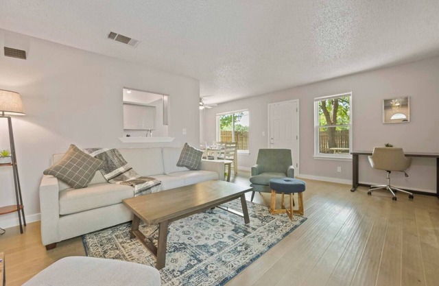 Airy and cheerful, newly renovated home is your sanctuary in bustling North Austin! 1,100+ SF of living area with roomy walk-in closets and large private backyard let you unpack and unwind.