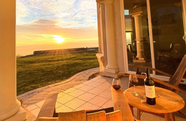 An elegant B&B with a pool & hot tub located above Moose Mountain Vineyards