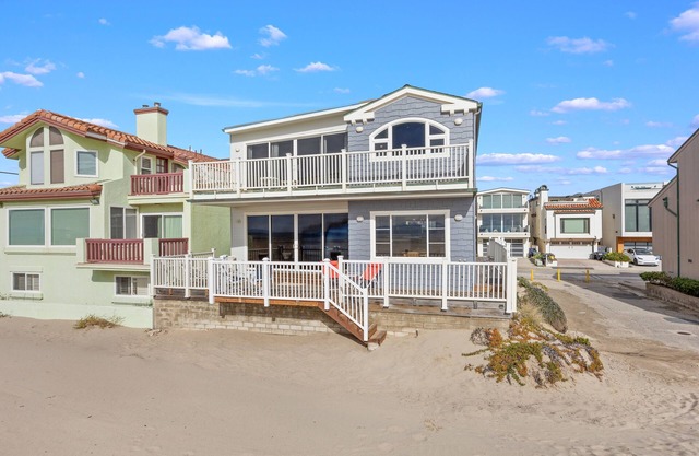 Beachfront abode with spacious deck, pool table, gas grill, smart TVs, & W/D