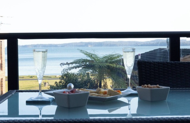 Beachfront, pet friendly, tri-level home in quiet leafy location with views