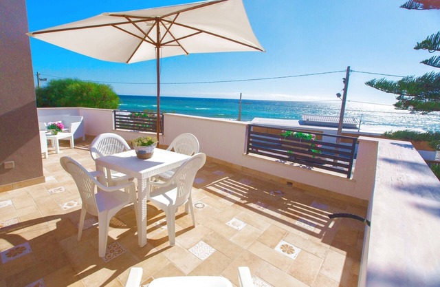 Blue Sea Beach Villa, beach front with pool and stunning sunsets