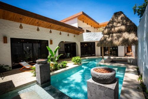 Bohemian Tropical Villa with a Tiki-Style Swimming Pool & Swim-Up Bar with an Attached Studio Apartment
