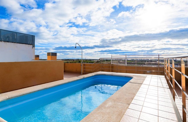 Bright and cozy apartment with shared pool and sea view.