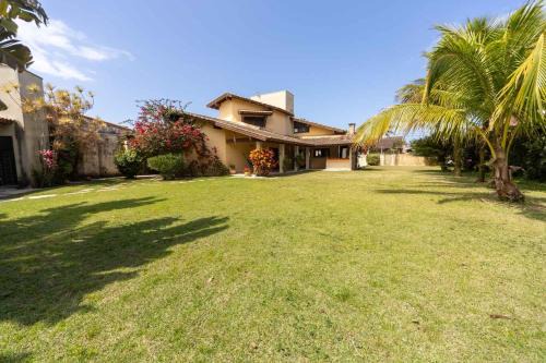 Casa com Area Gourmet e Quintal a 200 m da Praia