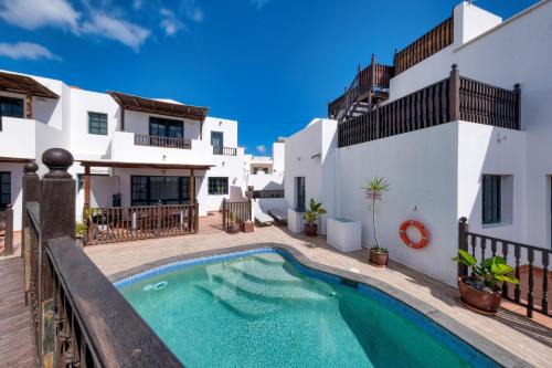 Casa Hibiscus - Shared Pool and BBQ - Close to Seafront Promenade By Lanzarote Vacation Homes
