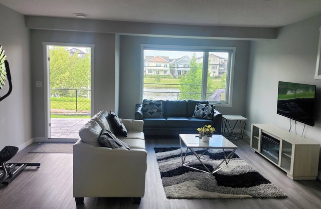 Charming 2-bedroom pond backing walk out suite with view of the lake in Beaumont