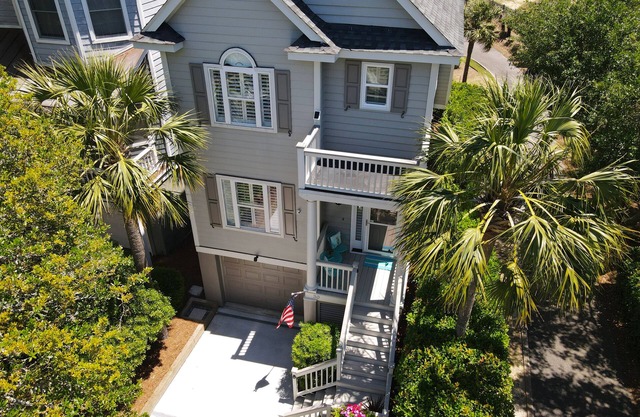 Charming house with ocean views and two decks; within a gated community