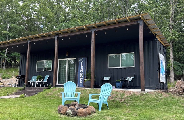 Charming shipping container home with lake view and boat ramp.