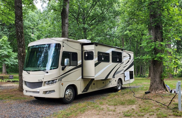 Class A RV on a private 5 Acre Property with RV campsite and trail.