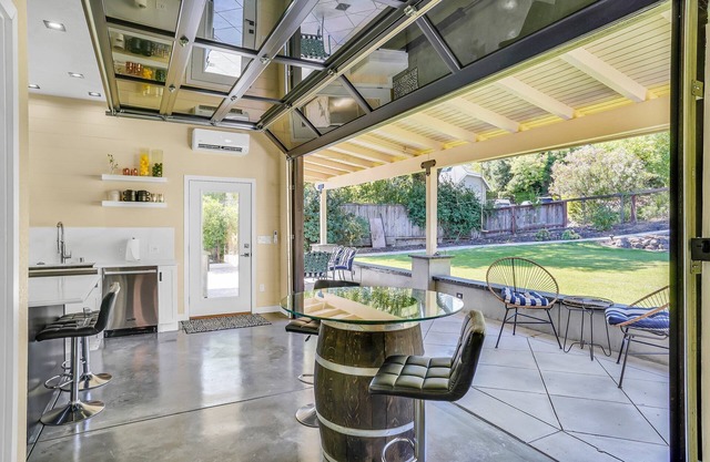 Dramatic and Unique Industrial Door Blurs The Boundaries Between Inside and Out