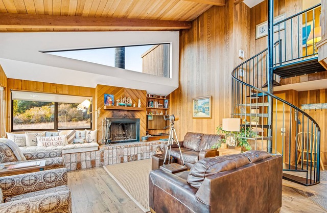 Eclectic coastal retreat w/ ocean view, private hot tub & spacious lofted layout