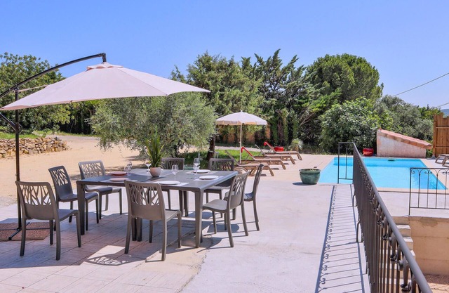 Enjoy a wonderful view of the countryside in this comfortable vacation home with pool!