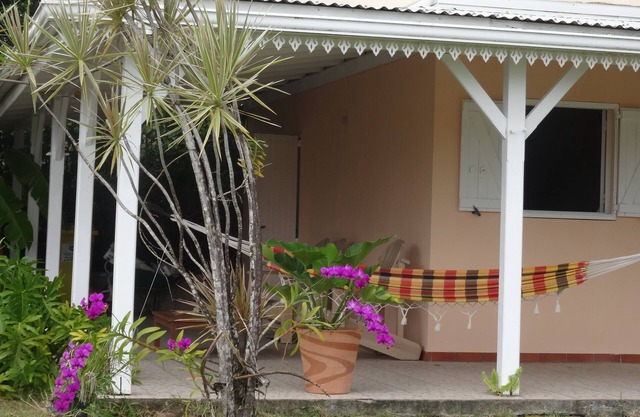 F2 Bottom corner villa with veranda and trees