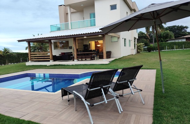 Family home, swimming pool and soccer field, in a gated community.