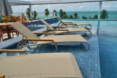 Flat 304, rooftop e piscina com vista HOA Beach