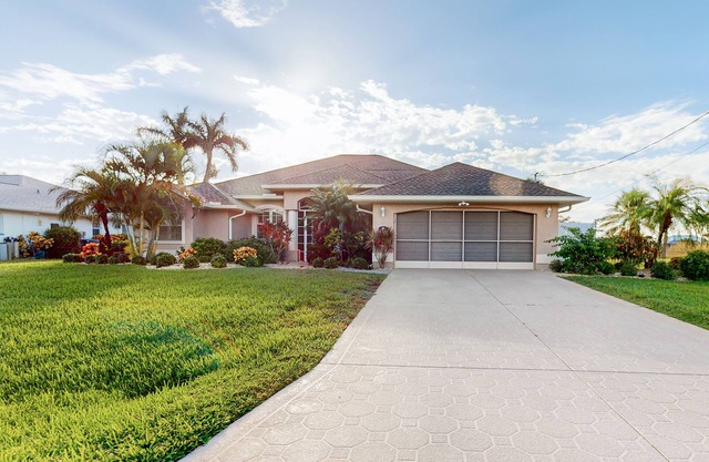 Golf course-view retreat with a private, heated pool, lanai, AC, & washer/dryer
