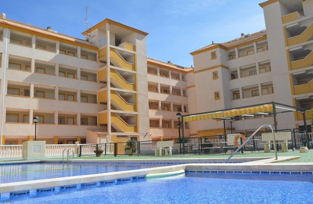 Ground floor apartment with large patio, communal pool