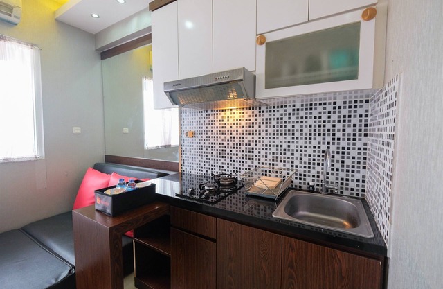 Homey and Relaxing 2BR Green Pramuka Apartment