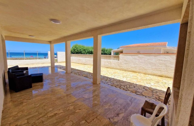 House kissed by the sea