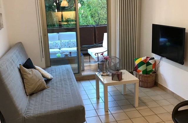 In a green setting with air conditioning, swimming pool and tennis court