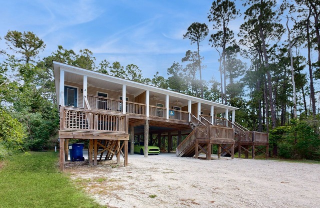 Inviting home near the beach with balcony, full kitchen, central AC, & W/D