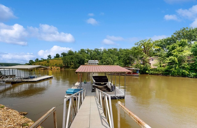 Lakefront home with 2 living rooms, 2 decks, grill, dock, foosball & w/d