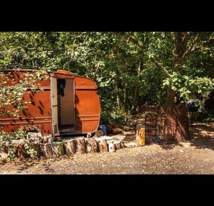 little vintage caravan with cosy log burner