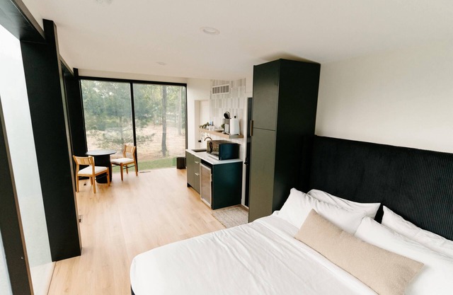 Luxurious mirrored cabin nestled on the Woods & Co Weddings + Events property for the ultimate getaway