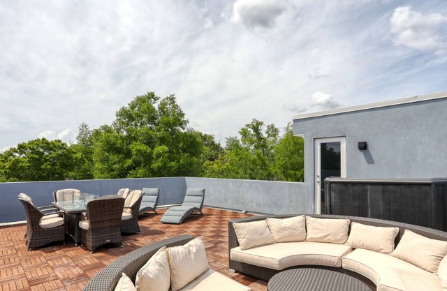 Modern hideaway with rooftop deck, firepit, game room, enclosed yard & WiFi