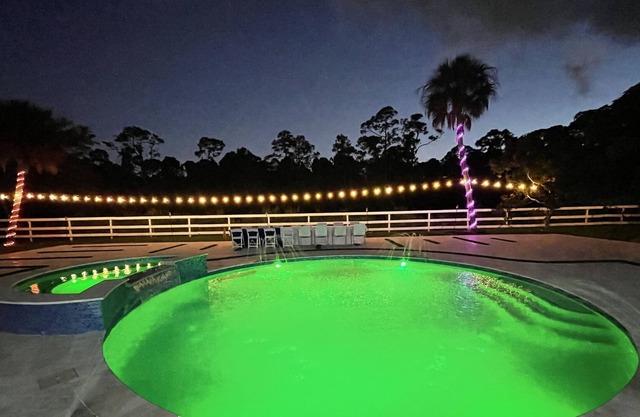 Modern home with heated swimming pool and 5 acre private lot