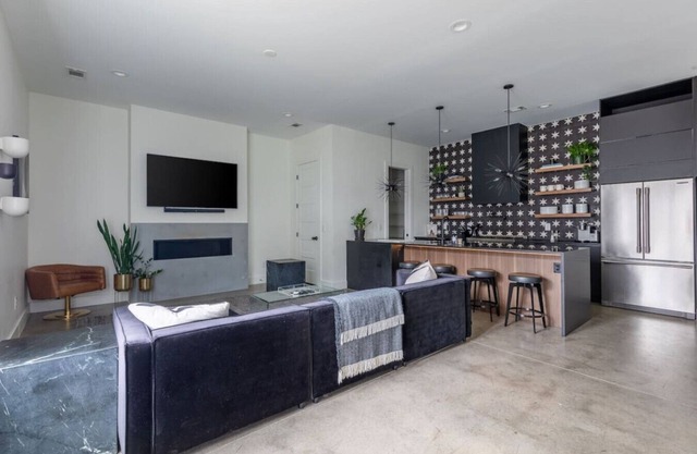 Modern Oasis: Rooftop Sunsets & City Lights!