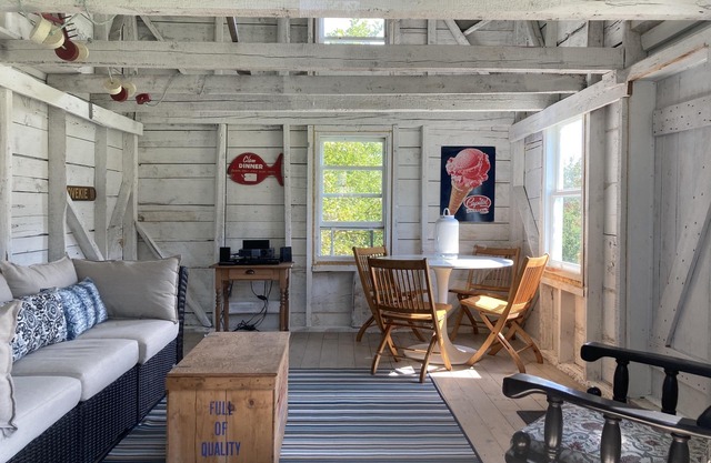 Modernized waterfront heritage homestead with entertainment barn