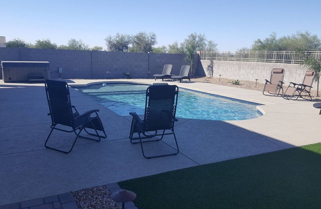 Newer Resort Style 4 bed home Open floor plan with HEATED Pool and Hottub