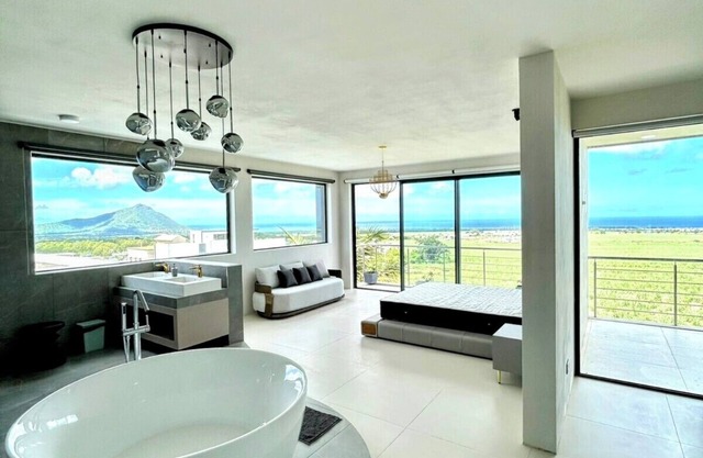 Ocean & Mountain views from a stunning 5-BR, 6.5-BA new villa at Cascavelle.